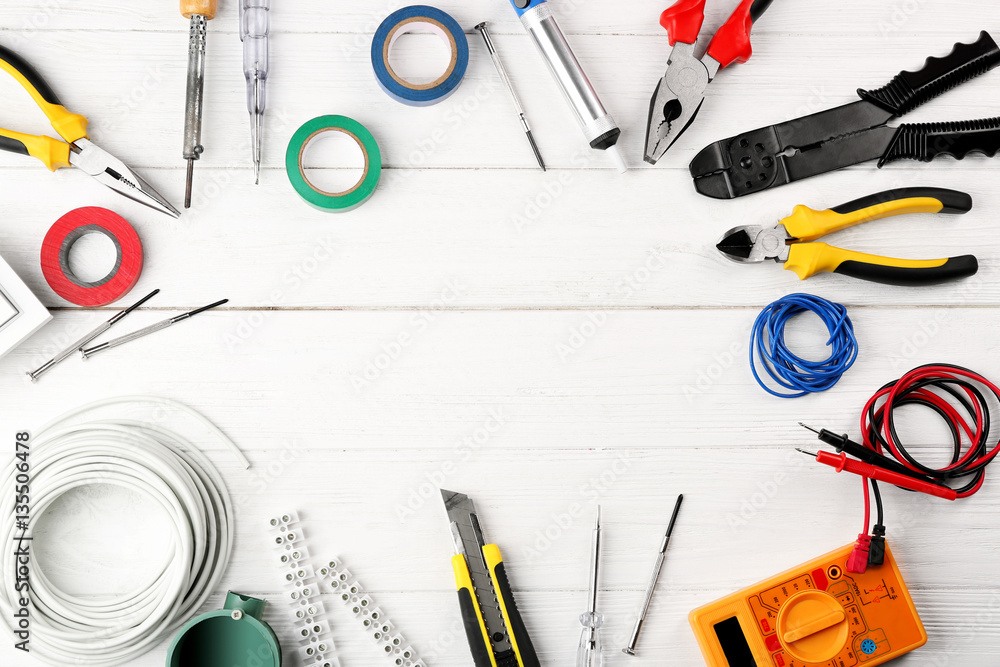 Wall mural different electrical tools on wooden table