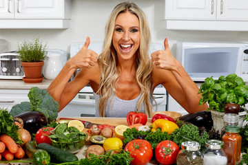 Happy woman cooking in the kitchen.