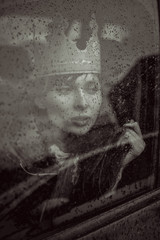 woman in the car in the rain