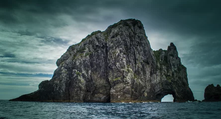 Poster Dramatic view of Hole in The Rock on a stormy day in the Bay of Islands New Zealand © agcreationsnz