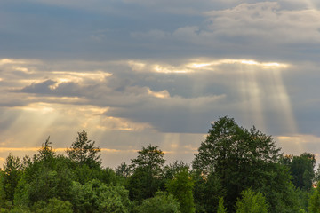 The sun's rays breaking through the clouds.