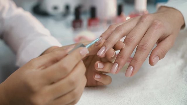 Woman hands during manicure procedure