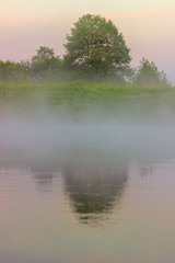 Fog over the river. Early morning.