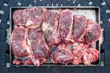 Raw Wagyu Kobe beef being prepared for barbecue cooking grilling