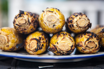 Summer grilled yellow golden corn barbecue charred