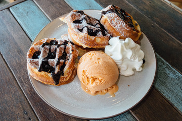 Waffle with ice cream and wiping cream