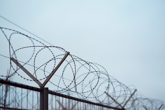 Fence with barbed wire. focus with shallow depth of field.