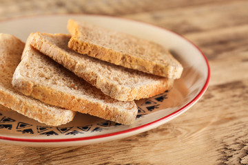 Fototapeta na wymiar Sliced fresh bread on wooden table closeup