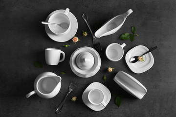 Obraz na płótnie Canvas White porcelain tea set on grey table