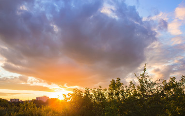 sunset sky over the buildings in the city