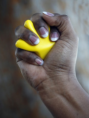 Hand of African-American woman squeezing stress reliever