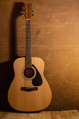 Obraz na płótnie Canvas Acoustic guitar on old steel background