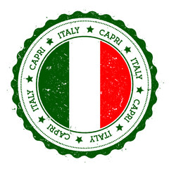Obraz premium Capri flag badge. Vintage travel stamp with circular text, stars and island flag inside it. Vector illustration.