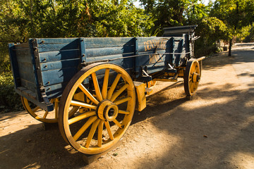 Fototapeta na wymiar Late afternoon over a gold rush era horse drawn wooden freight wagon in Columbia, California