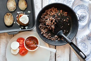 Ingredients for cooking Parmigiana di melanzane: baked eggplant