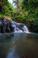 The woman in Huay Mae Kamin Waterfall in Kanchanaburi province, Thailand