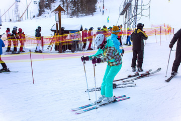 Skiers on the slope in Strbske Pleso ski resort. Slovakia.
