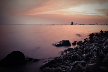 Sunset seascape on the stone beach.
