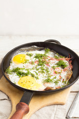 fried egg in a cast iron frying pan