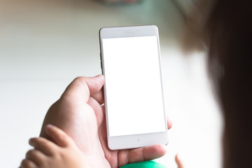 Little girl watching cartoon on mobile device.