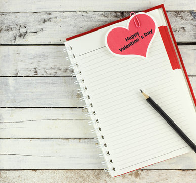 Notebook open with valentine day card