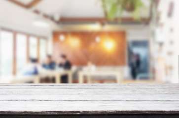Selected focus empty brown wooden table and Coffee shop or resta
