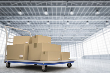 warehouse trolley with heap of storage boxes