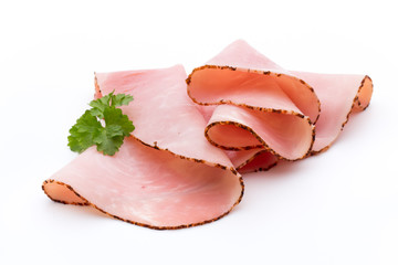 Thin slices of ham on white background.