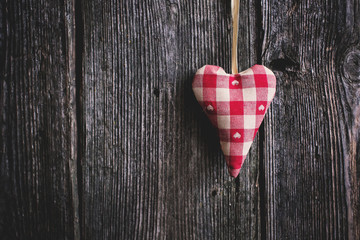 Heart on a wooden background. The motive for Valentine's Day.