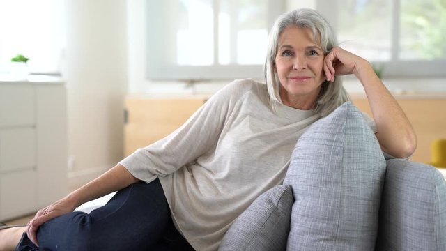 Portrait of senior woman relaxing in sofa