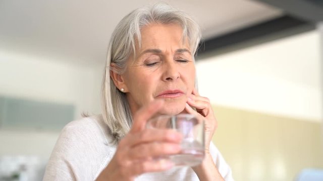Senior woman with toothache