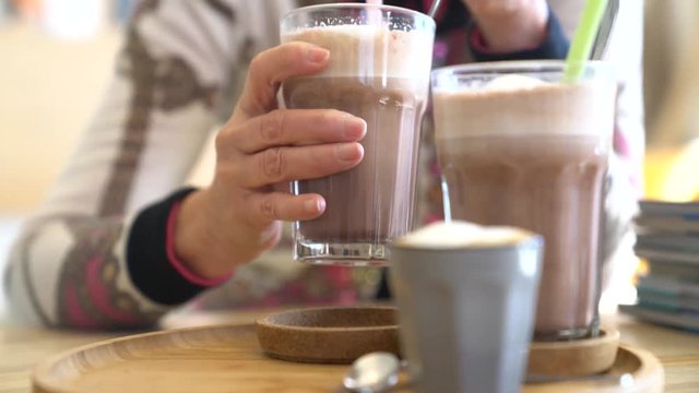 Senior woman drinking hot chocolate in coffee shop