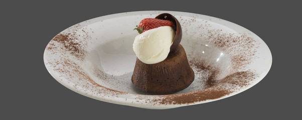 dessert cake with ice cream and strawberries on a plate isolated