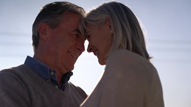 Portrait of senior couple embracing each other