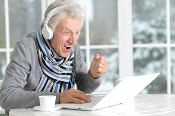 mature man using laptop