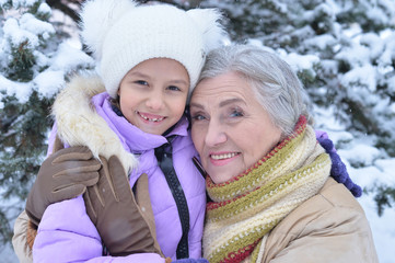 grandmother with granddaughter smiling