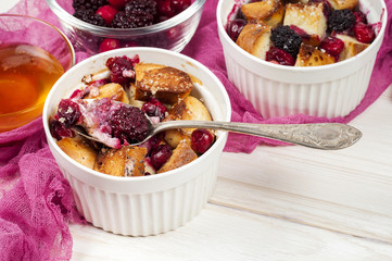 French toast casserole with cranberries, raspberries and blackbe