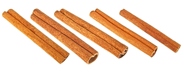 Set of cinnamon sticks on a white background