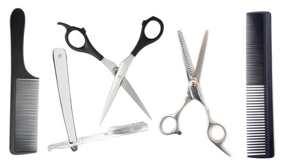 Comb with scissors and razor on a white background