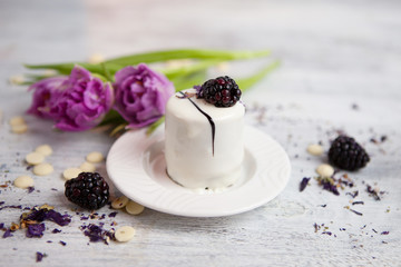 Cake with blackberry and tulip, Valentines Day background. Selective focus