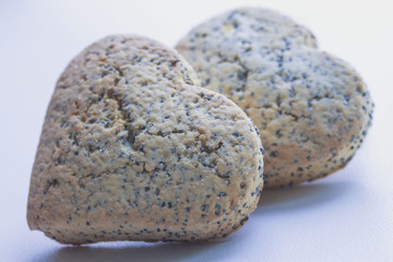 Two shortbread hearts with a poppy