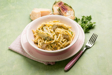 trofie pasta with artichoke and parmesan cheese