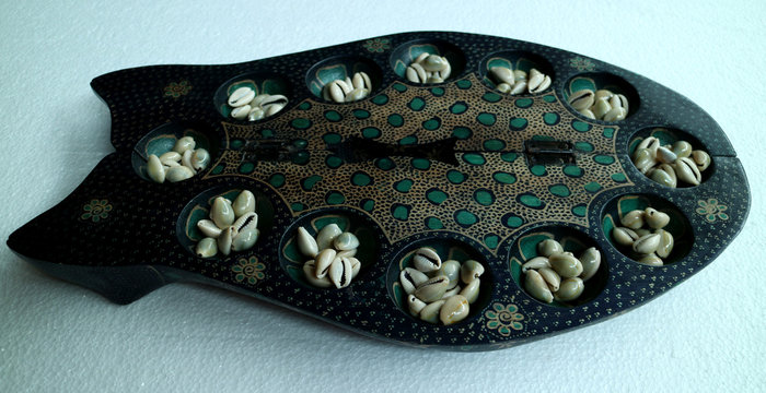 Batik Mancala from Java, Indonesia. Mancala is a family of board games played around the world. Also known as Dakon or Congklak in South East Asia.