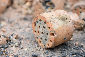 Close up of burned coal being thrown to the nature that may cause pollution  