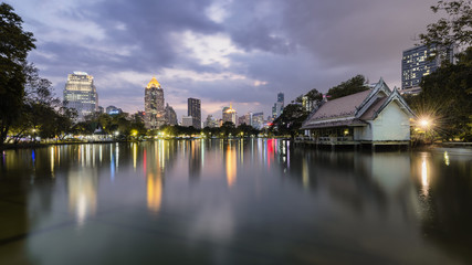 Fototapeta premium Bangkok skyline from Lumpini Park in the night of Chinese New Year Eve