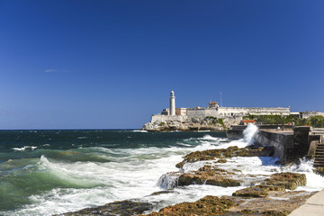 View of the lighthouse near caribbean sea waterfront in Havana a