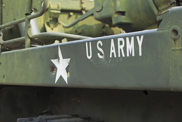 Tank close-up with text US Army on it. 