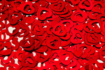Valentines day background of red hearts confetti. Festive Valentine.
