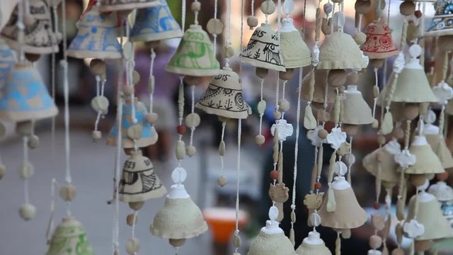 Bell clay souvenir gift at the fair, Clay bells Souvenir gift at the market Sorochyntsi, Ukraine