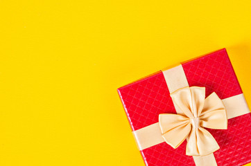 Red gift box on yellow color background.